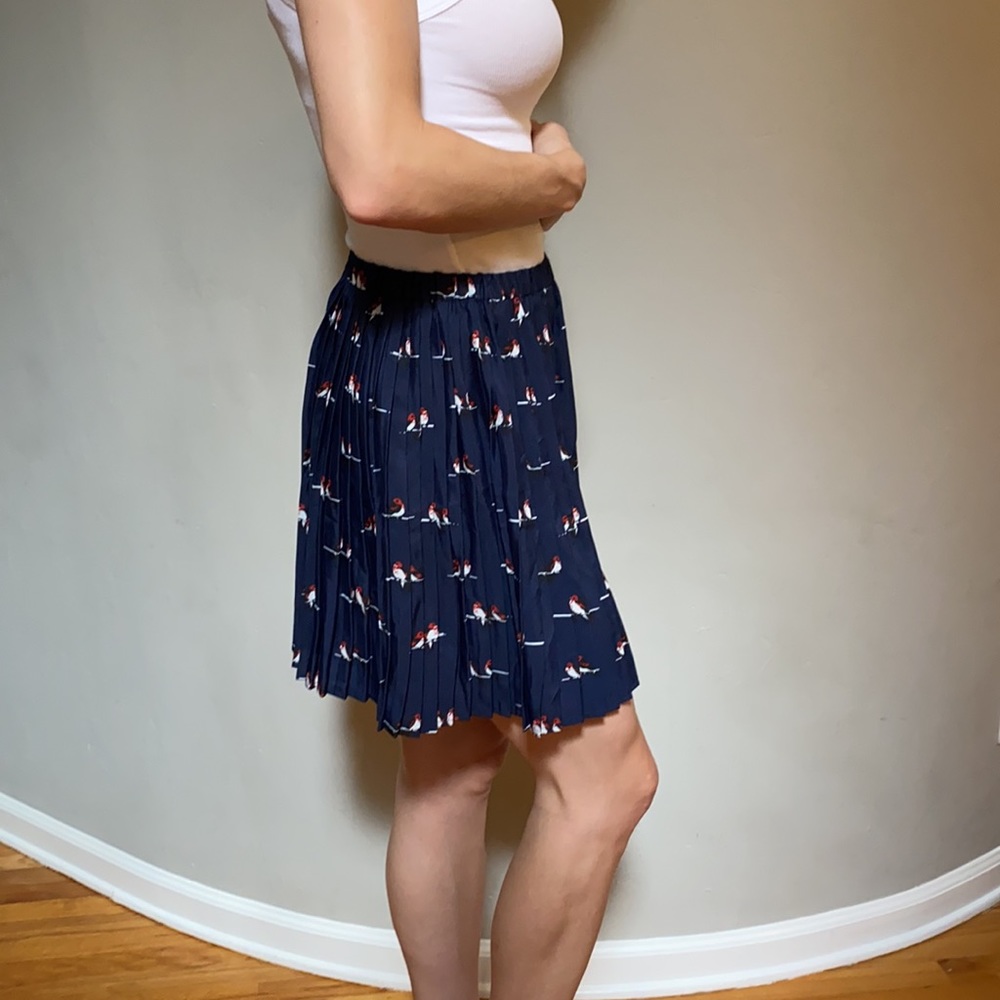 navy pleated skirt with bird print